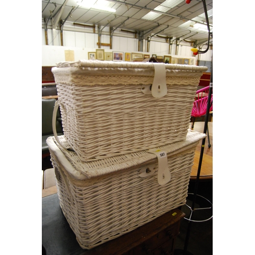 587 - 2 WHITE PAINTED CANE HAMPERS WITH MATERIAL LINERS