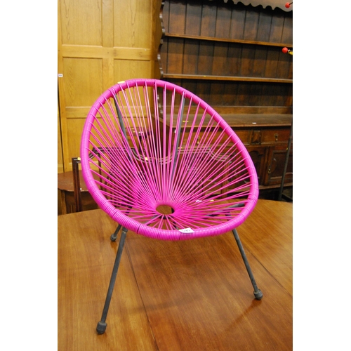 595 - RETRO PINK PLASTIC STRINGWORK TUB CHAIR ON METAL SUPPORTS