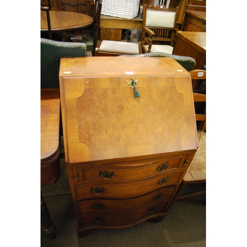 627 - REPRODUCTION WALNUT SERPENTINE FRONTED BUREAU FITTED 4 DRAWERS ON BRACKET FEET