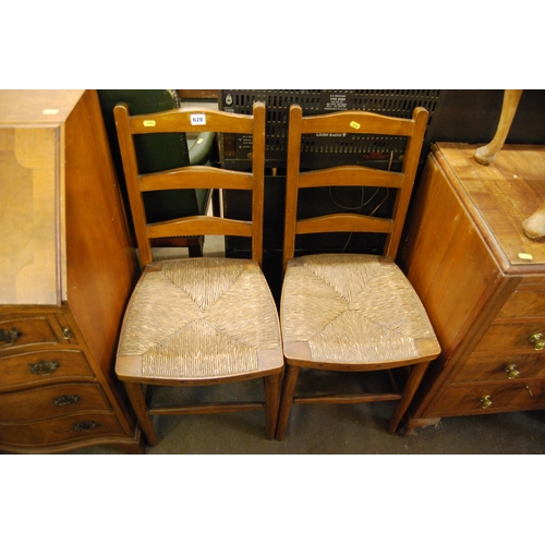 628 - PAIR OF RUSH SEATED LADDER BACK CHAIRS