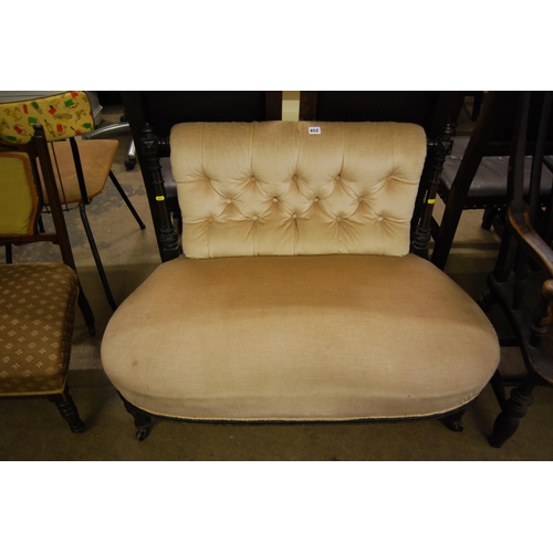 652 - VICTORIAN EBONISED SALON COUCH WITH BUTTON BACK AND SHAPED SEAT