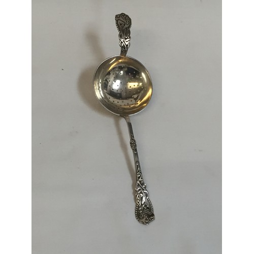 295 - DANISH SILVER TEA STRAINER WITH EMBOSSED HANDLE & REST BY CHRISTIAN F HEISE (1.6ozs)