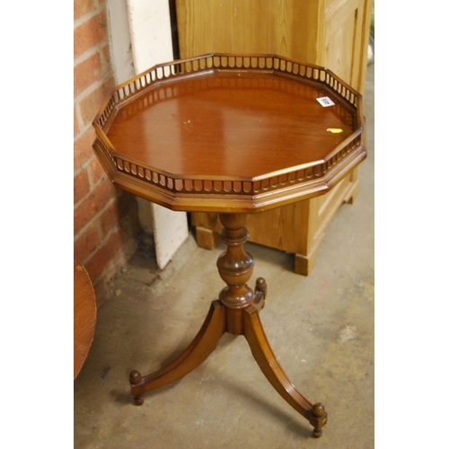 469 - REPRODUCTION MAHOGANY DODECAGON WINE TABLE WITH GALLERIED RIM