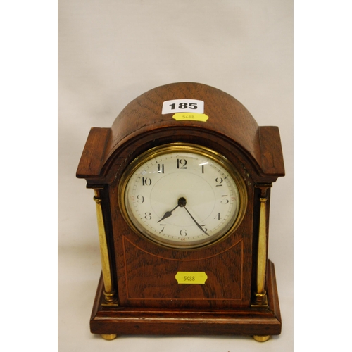 185 - EDWARDIAN INLAID MAHOGANY DOME TOP MANTLE CLOCK WITH BRASS COLUMNS & FEET