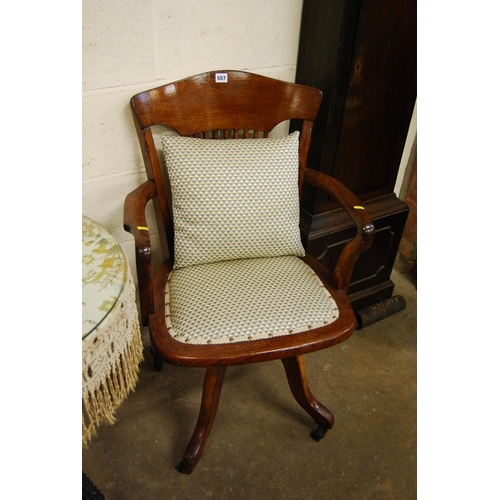 557 - EDWARDIAN OAK SWIVEL OFFICE ARMCHAIR