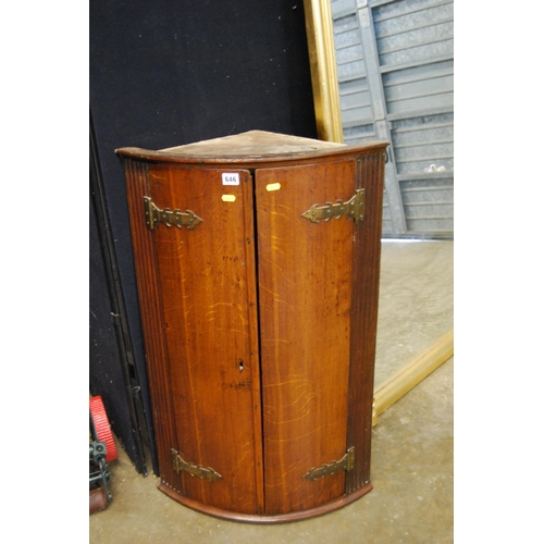 646 - GEORGIAN OAK BOW FRONTED CARVED CUPBOARD FITTED 2 SHAPED SHELVES, BRASS STRAP HINGES