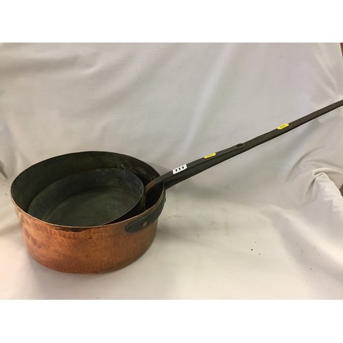 111 - TWO 19TH CENTURY SAUCEPANS WITH LONG IRON HANDLES