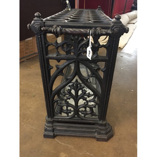 298 - LARGE CAST IRON STICK STAND WITH 24 RECESSES PIERCED FOLIATE SIDE SUPPORTS, 2 ROPE TWIST & ACANTHUS ... 