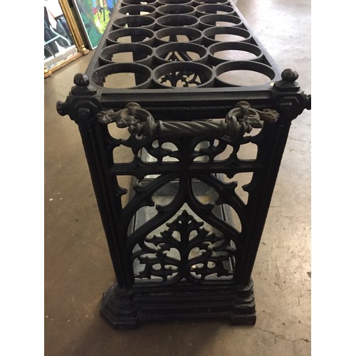 298 - LARGE CAST IRON STICK STAND WITH 24 RECESSES PIERCED FOLIATE SIDE SUPPORTS, 2 ROPE TWIST & ACANTHUS ... 