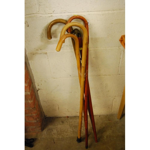 34 - BRASS DUCK HEAD WALKING STICK & 4 OTHER STICKS