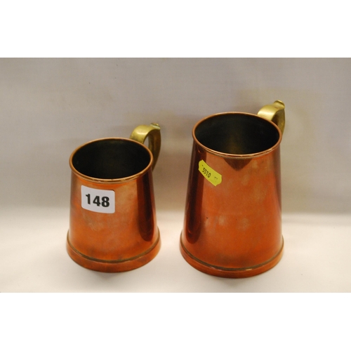 148 - 2 COPPER TANKARDS WITH BRASS SCROLL HANDLES