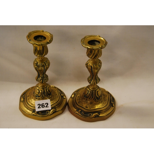 262 - PAIR OF 19TH CENTURY EMBOSSED BRASS CANDLESTICKS