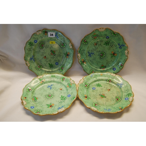 34 - FOUR 19TH CENTURY GREEN GROUND PLATES DECORATED WITH STYLIZED FLOWERS