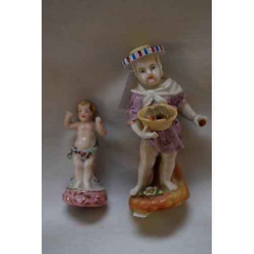 71 - EARLY 19TH CENTURY AUGUSTUS REX PORCELAIN FIGURE OF GIRL HOLDING BASKET OF BIRDS & PORCELAIN CHERUB ... 