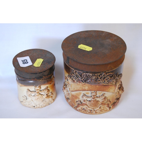 85 - 2 LATE 19TH CENTURY STONEWARE CHEMISTS JARS EMBOSSED COATS OF ARMS WITH TIN LIDS