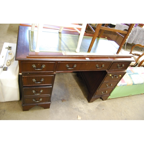 594 - REPRODUCTION MAHOGANY KNEEHOLD DESK FITTED 5 DRAWERS & CUPBOARD, GREEN TOOLED LEATHER TOP