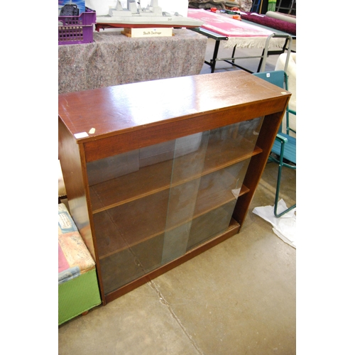 597 - RETRO OAK BOOKCASE WITH SLIDING GLASS DOORS