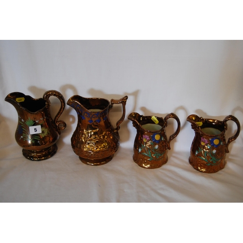 5 - FOUR 19TH CENTURY EMBOSSED COPPER LUSTRE JUGS