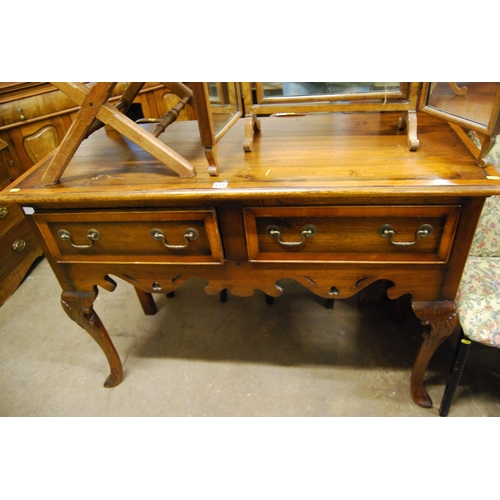 671 - REPRODUCTION OAK DRESSER BASE FITTED 2 DRAWERS, DROP BRASS HANDLES, ON CABRIOLE LEGS, PIERCED SHAPED... 