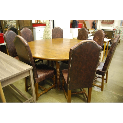 396 - LARGE CIRCULAR ELM DOUBLE GATE LEG TABLE AND SET OF 8 HIGH BACK LEATHER DINING CHAIRS (204cm X 205cm... 