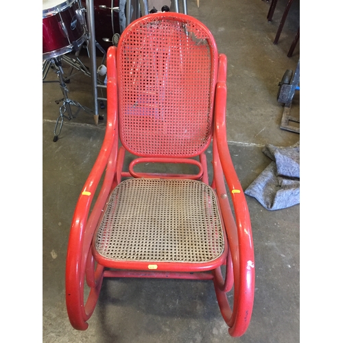 519 - RED BENTWOOD ROCKING CHAIR; A/F