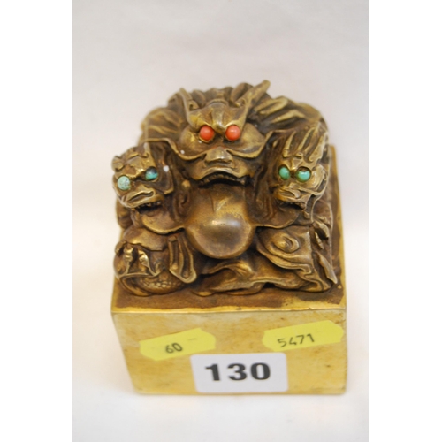 130 - GILT BRONZE CHINESE DRAGON SEAL INSET WITH TURQUOISE & CORAL EYES