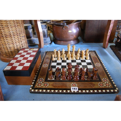 183 - STAINED BEECH CHESS SET ON INDIAN INLAID BOARD (WITH STORAGE BOX) AND MAGNETIC TRAVEL CHESS SET