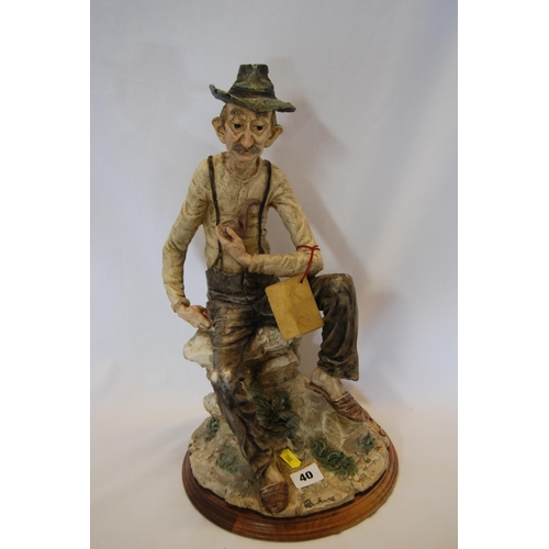 40 - LARGE CAPODIMONTE FIGURE OF SEATED OLD MAN WITH PIPE