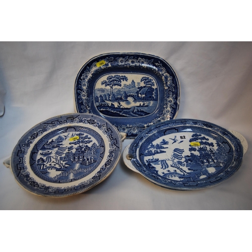 82 - TWO 19TH CENTURY BLUE & WHITE WILLOW PATTERN HOT WATER PLATES AND OVAL PLATE DECORATED 