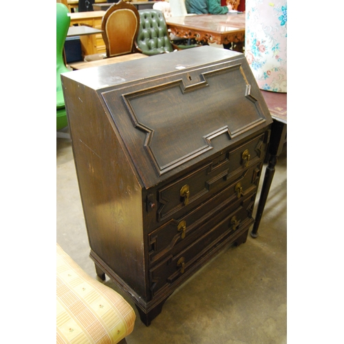 455 - JACOBEAN STYLE OAK BUREAU FITTED 3 DRAWERS