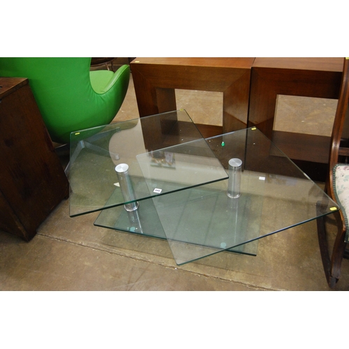 480 - MODERN PLATE GLASS COFFEE TABLE ON STAINLESS STEEL SUPPORTS