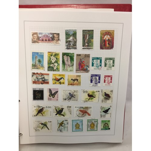 323 - 26 ALBUMS OF WORLD STAMPS (THE PHOTOS SHOW ONLY A SMALL AMOUNT OF THE TOTAL CONTENTS)