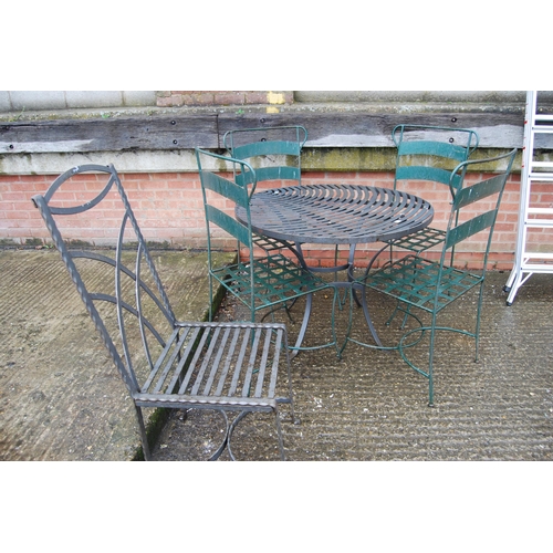 566 - CIRCULAR HEAVY IRON GARDEN TABLE, 4 CHAIRS & 1 CHAIR