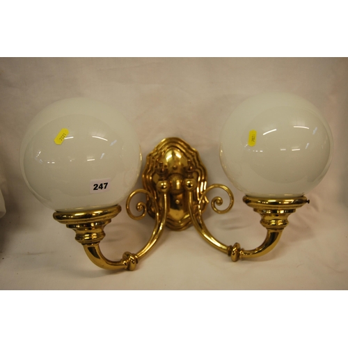 247 - BRASS TWIN BRANCH WALL LIGHT WITH WHITE SPHERICAL GLASS SHADES