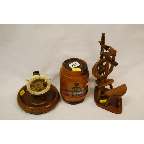 251 - WOOD AND BRASS SHIPS WHEEL NUTCRACKER, JAMAICAN WOODEN BARREL AND MODEL SPINNING WHEEL