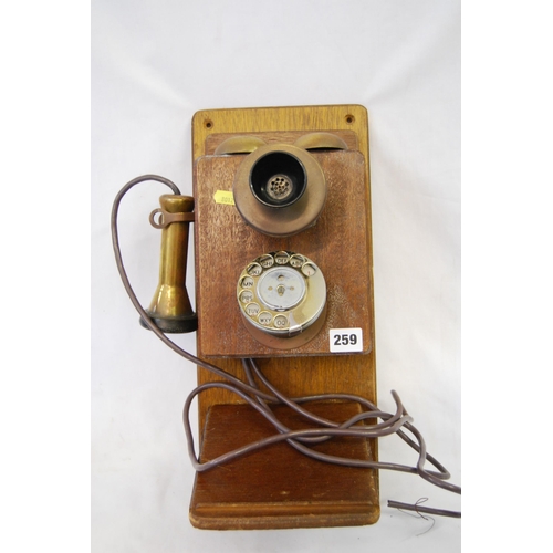 259 - VINTAGE WALL MOUNTED TELEPHONE WITH BRASS & BAKELITE FITTINGS ON OAK BRACKET