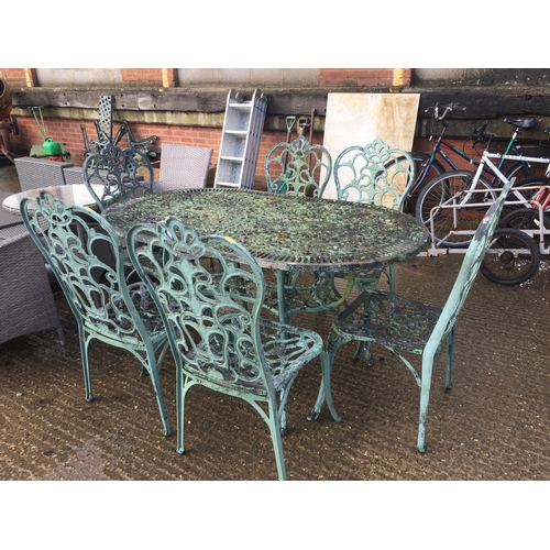 675 - OVAL METAL GARDEN TABLE AND 6 CHAIRS