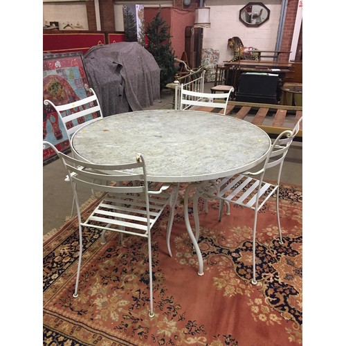 693 - CIRCULAR WROUGHT IRON MARBLE TOPPED GARDEN TABLE AND 4 CHAIRS