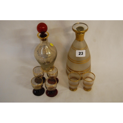 23 - 2 RETRO TINTED GLASS PART LIQUEUR SETS COMPRISING DECANTER & 4 GLASSES AND DECANTER & 2 GLASSES