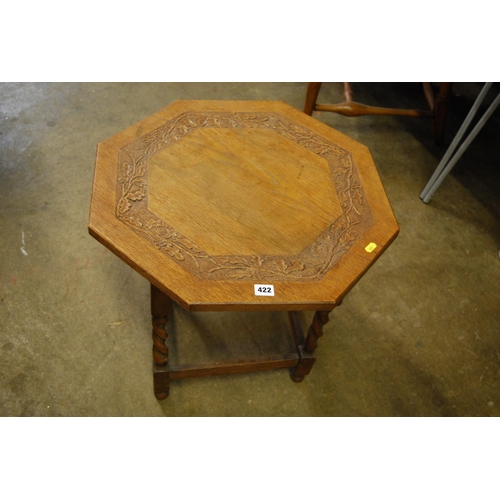 422 - OCTAGONAL CARVED OAK COFFEE TABLE WITH OAK LEAF DECORATION ON BARLEY TWIST SUPPORTS