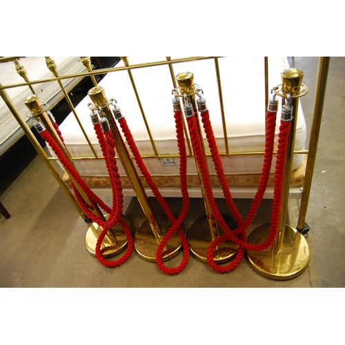 566 - 4 BALL TOP GILDED STANCHION BARRIER POSTS WITH ROPES