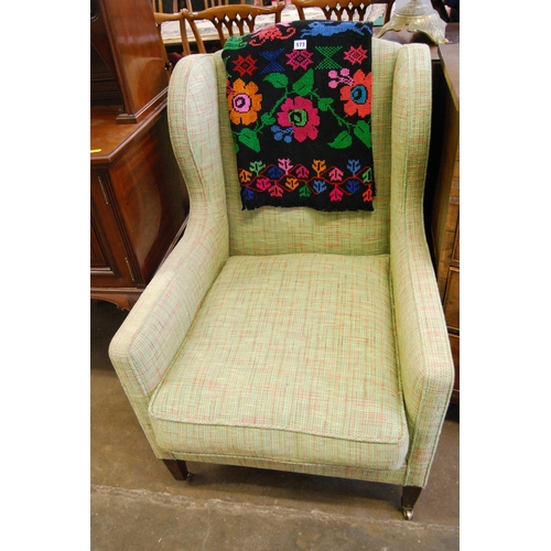 573 - EDWARDIAN EAR CAP ARMCHAIR ON SQUARE TAPER LEGS & CASTORS