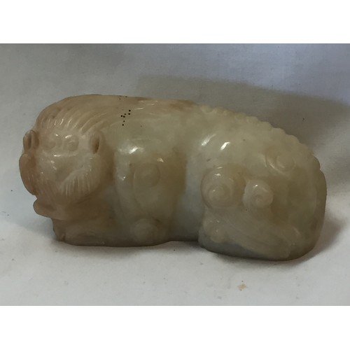 70 - PALE GREEN & RUSSET JADE RECUMBENT MYTHICAL BEAST YUAN/MING DYNASTY (9.5CM)