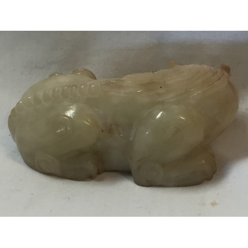 70 - PALE GREEN & RUSSET JADE RECUMBENT MYTHICAL BEAST YUAN/MING DYNASTY (9.5CM)