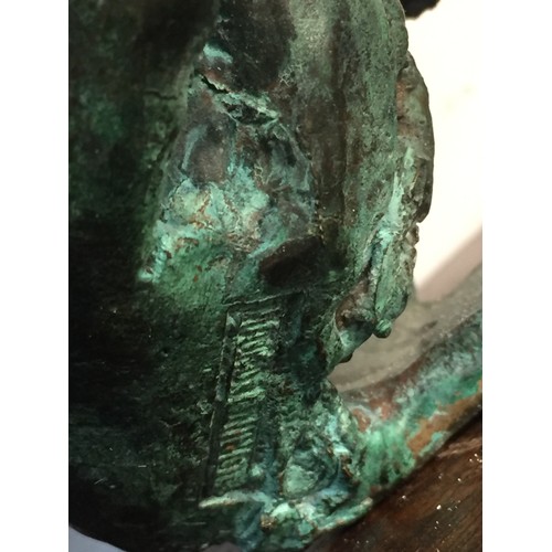 125 - BRONZE BUST OF A LADY MOUNTED ON WOOD PLINTH