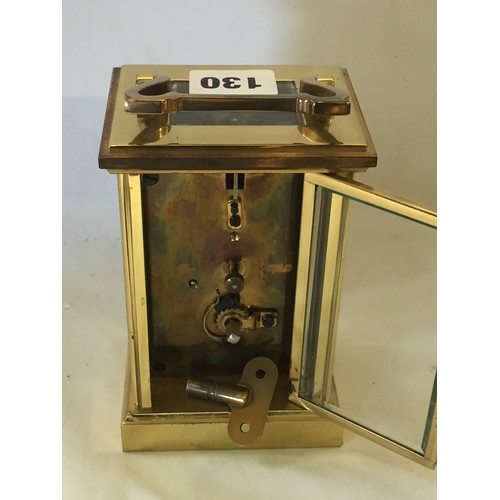 130 - IMPERIAL BRASS CARRIAGE CLOCK WITH WHITE ENAMEL DIAL, BEVELLED GLASS PANELS AND CARRYING HANDLES