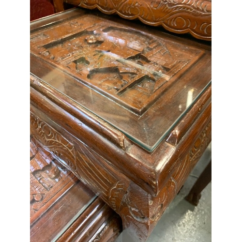 167 - A set of 3 heavily carved oriental nest of tables