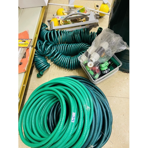 45 - Large quantity of garden hoses and fittings