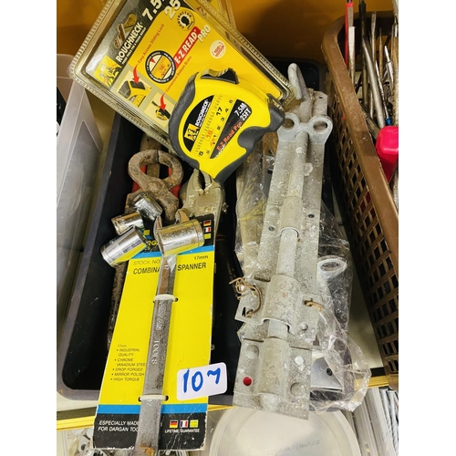 107 - Box of tape measure, combination tools, running bolt etc