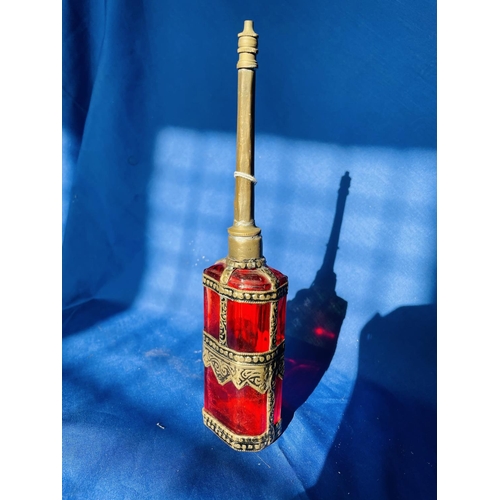 57 - Red glass and white metal oil can